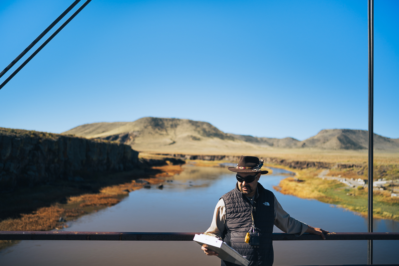 Esteban Salazar standing at the Lobatos Bridge, a significant historical and cultural area in Southwestern Colorado.